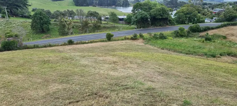 Sloping rural block beside the road, photographed before earthworks begin